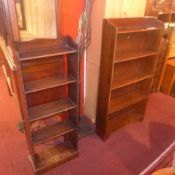 An oak open bookcase of narrow proportio