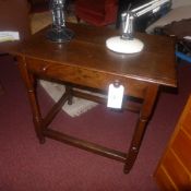A Georgian oak side table fitted single drawer on turned supports