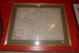 A maple framed map of Germany divided in