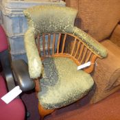 A C19th oak captains chair upholstered i
