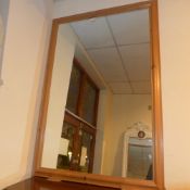 A large rectangular pine framed wall mir