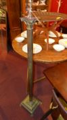 A brass Corinthian form standard lamp ra