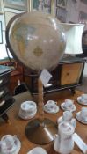 A C20th terrestrial globe raised on turn