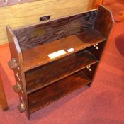 A set of open bookshelves of small propo