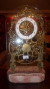 A brass skeleton clock on marble style b