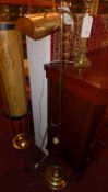 A brass lamp standard with over hanging