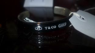 A ladies bangle marked Tiffany and Co 92