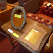 A carved Indian photograph frame with Ar