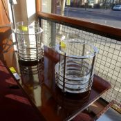A chrome and glass cylindrical storm lan