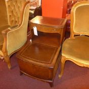 A C20th mahogany two tier table on squat