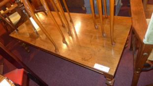 A walnut low table the rectangular top r