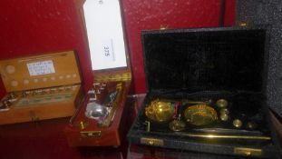Two set of jewellers weighing scales in