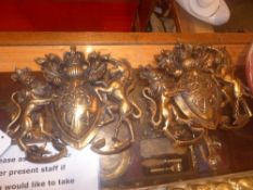 A pair of coat of arms with distressed g