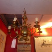 A Queen Anne revival brass chandelier of six branches