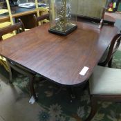 A Regency mahogany breakfast table the tilt top raised on quadruped base