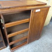 A C19th mahogany campaign press having pair of panel doors enclosing trays by brass swan neck