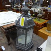 A large glass and verdigris metal hangin