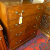 A C19th figured mahogany  chest of four graduated drawers with brass drop handles raised on a plinth