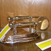 A chromium desk set compromising magnify