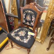 A Victorian mahogany nursing chair havin