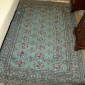 A hand knotted Bokhara rug the green gro