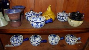 A collection of blue and white soup ture
