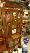 A mahogany hall stand with inset bevelle