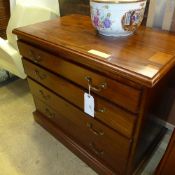 A Georgian mahogany chest of four graduated drawers with brass drop handles on a plinth base