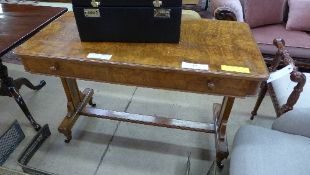A Victorian walnut library table the rectangular top above frieze drawer on stretchered support