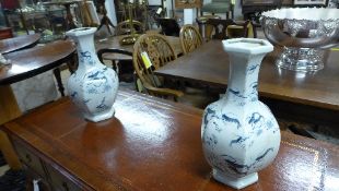 A pair of blue and white Chinese style vases with lobster decoration