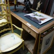 A pine pedestal desk with leather top over arrangement of drawers (no panels)