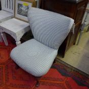 A boudoir chair upholstered in striped f