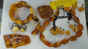 A collection of butterscotch and semi-translucent amber jewellery to include a string of