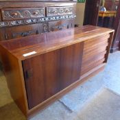 A rosewood Danish sideboard with sliding