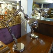 A pair of nickel plated adjustable table