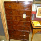 A mid C20th walnut tallboy with seven drawers on squat cabriole supports W 77 D 47 H 153 cm