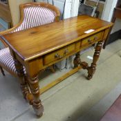 A teak two drawer hall table united by u