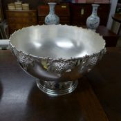 A large  silver plated punch bowl with grape decoration