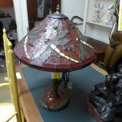 A Tiffany lamp with dragon fly decorated shade