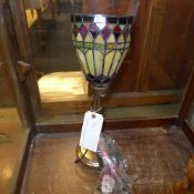 A bronzed Art Deco style lamp with lady shade