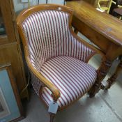 A French bergere upholstered in striped