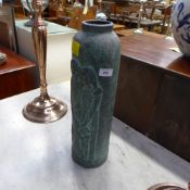 A large terracotta vase, verdigris glaze