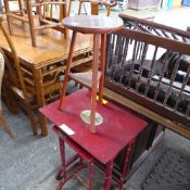 A red lacquer Regency style nest of two tables and a Chinoiserie circular table