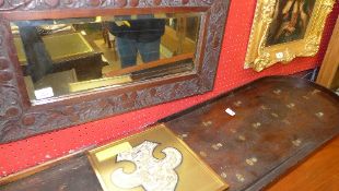 An Oriental needlework arrangement and carved mirror and bagatelle board
