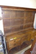 A late C18th oak dresser the open plate