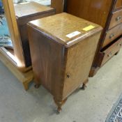 An Art Deco burr walnut pot cupboard on