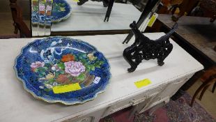 A cloisonne charger with basket of flowe