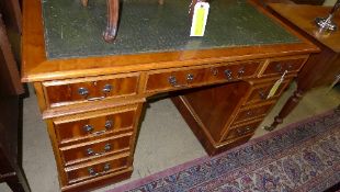 A yewood pedestal desk the tooled leathe