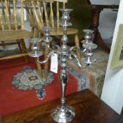 A chromium five light candelabra on step