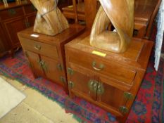 A pair of Chinese hardwood bedside cabin